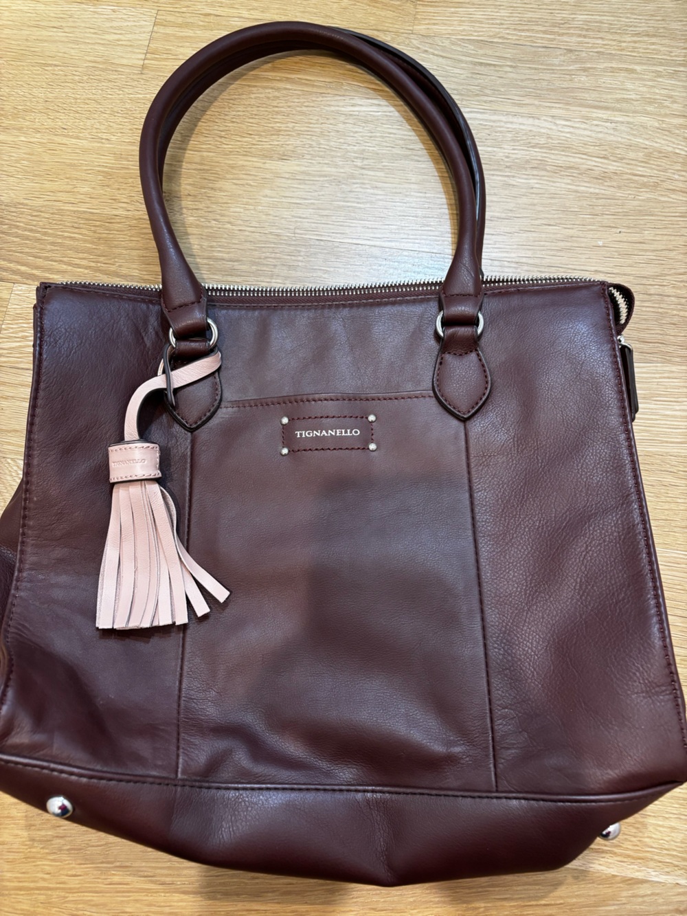 Tignanello Burgundy Leather Tote with Pink Tassel Accent